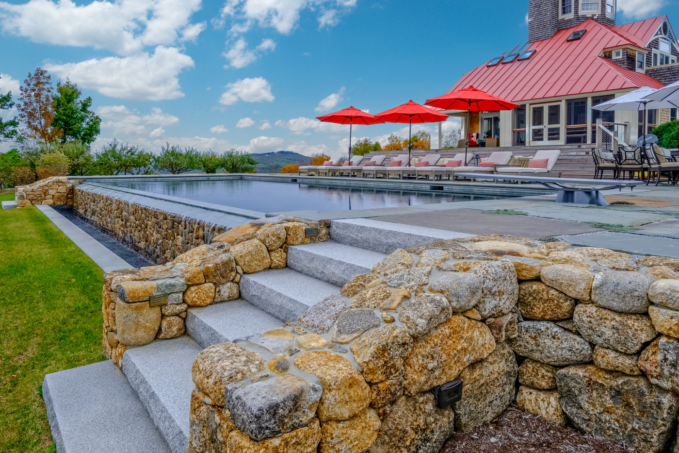 Pool terrace with a view by high-end landscape design/build firm Pellettieri Associates, Inc.