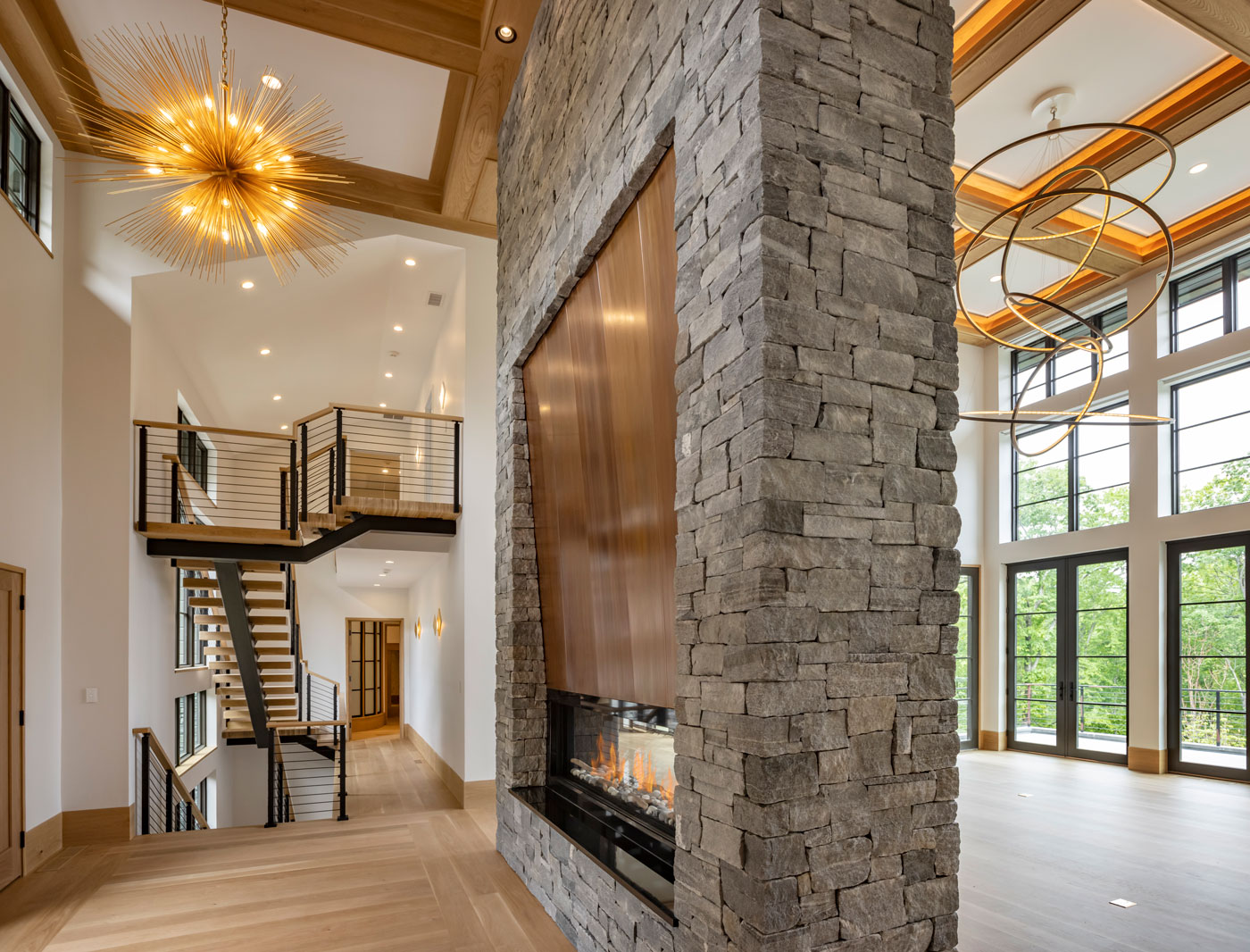 open floor plan of modern house with a fireplace in the middle