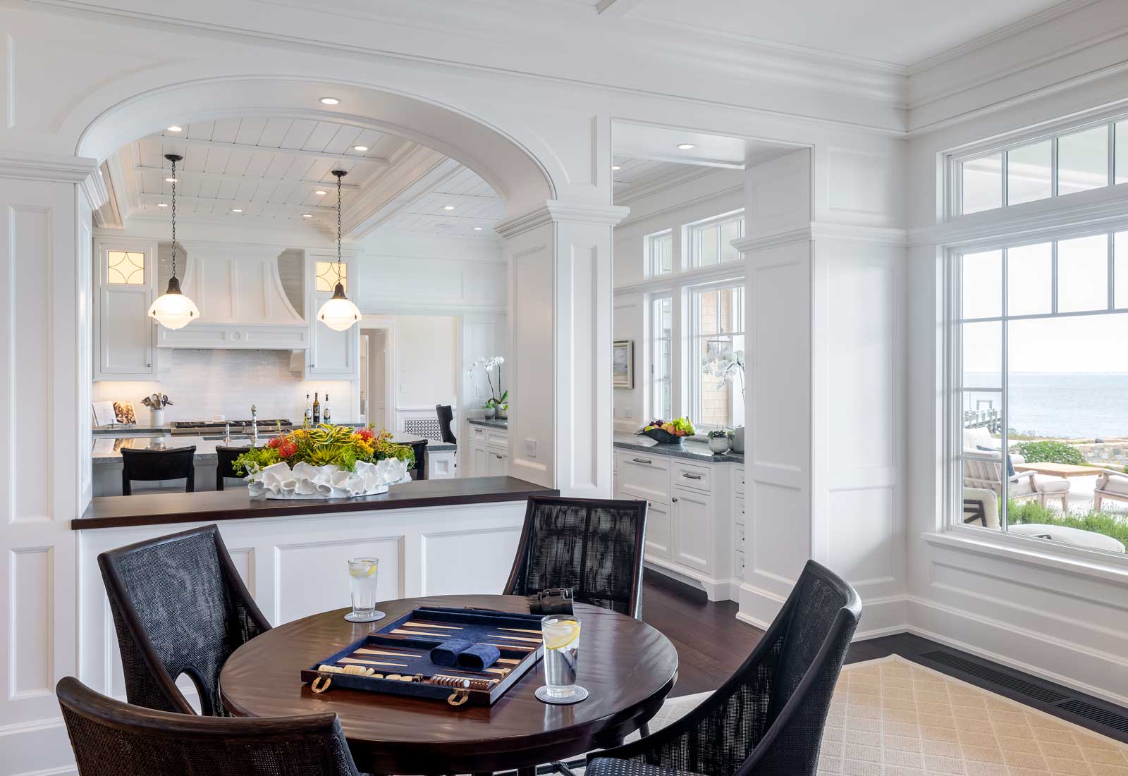 Shingle Style Ocean Home - dining area and kitchen by Howland Company Inc.