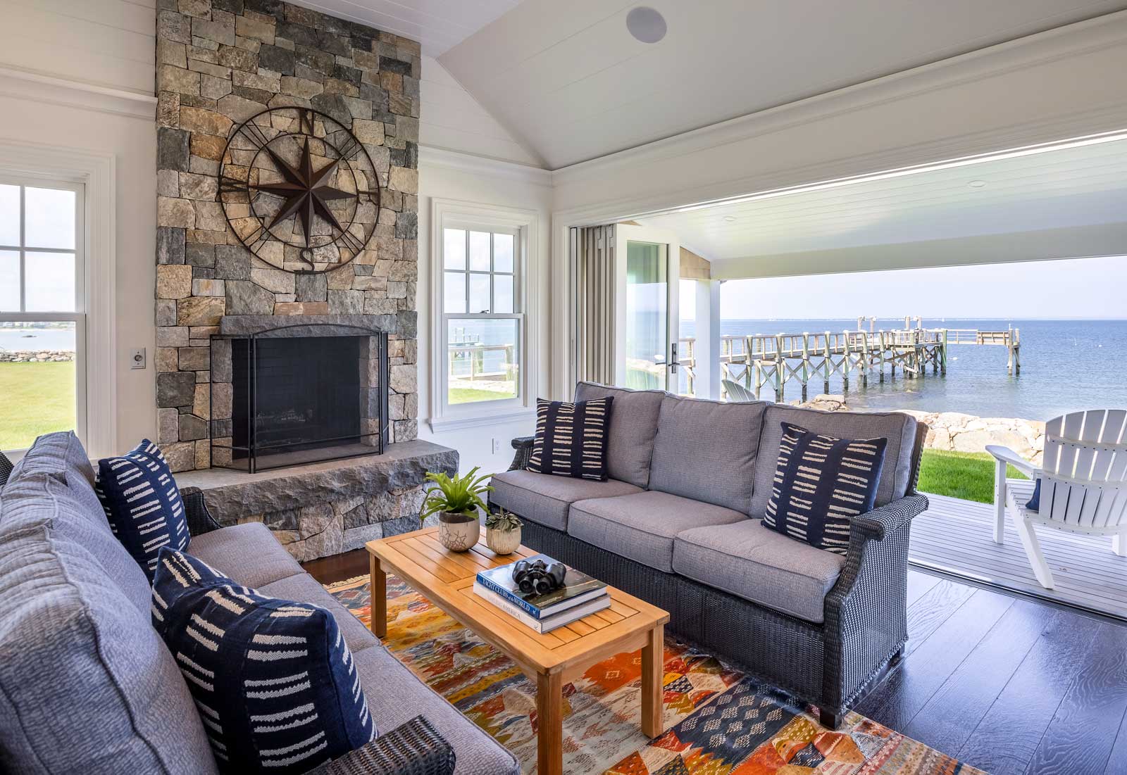 Shingle Style Ocean Home - Guest house Family room open to the water by Kotzen Interiors, LLP