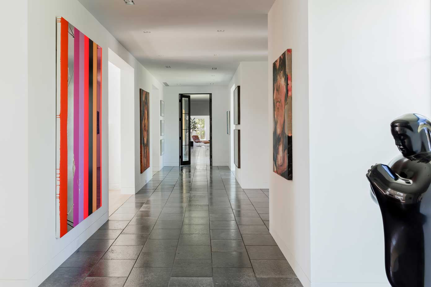 hallway with art along the walls