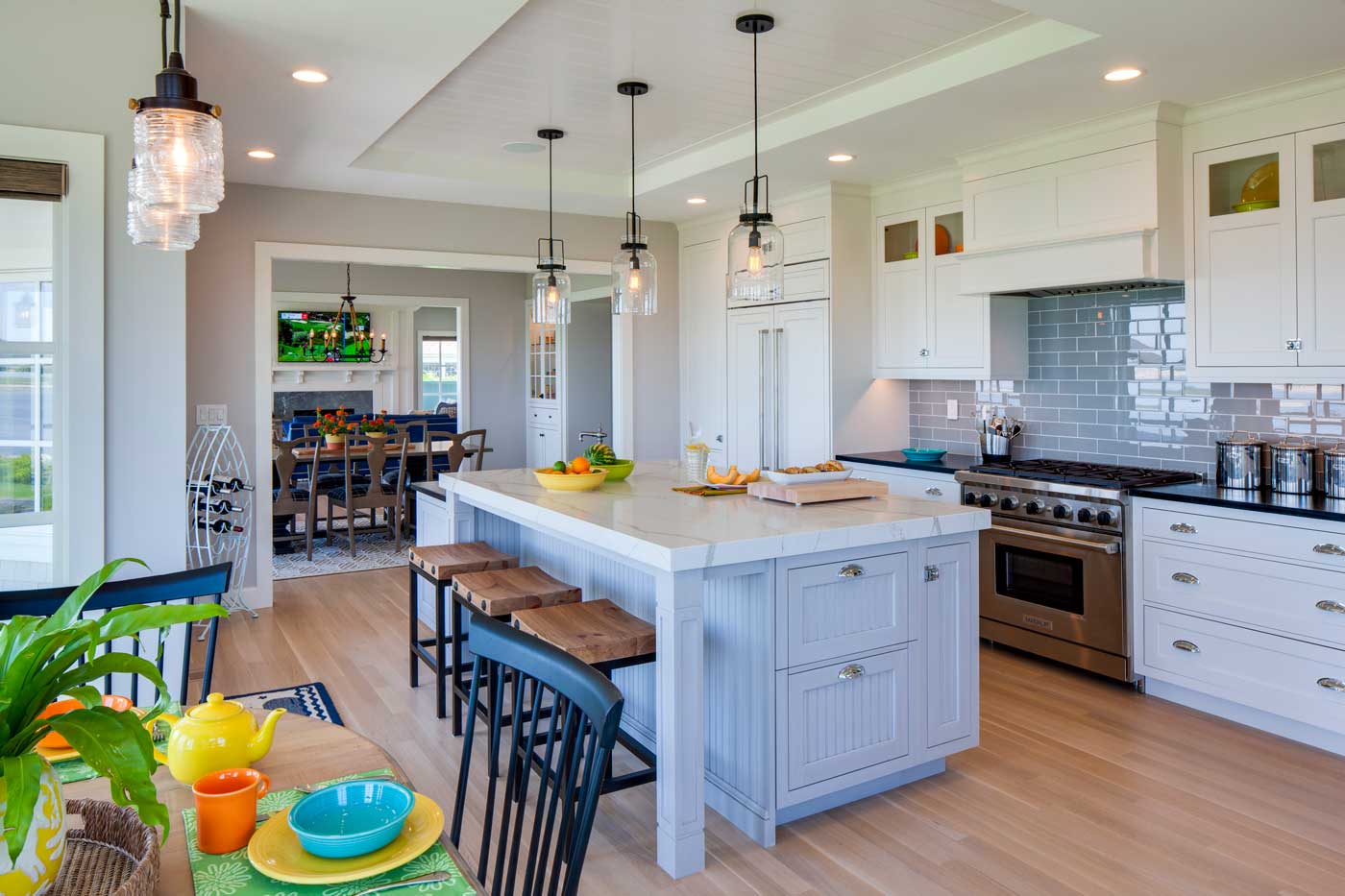 custom white kitchen with big bar in the center