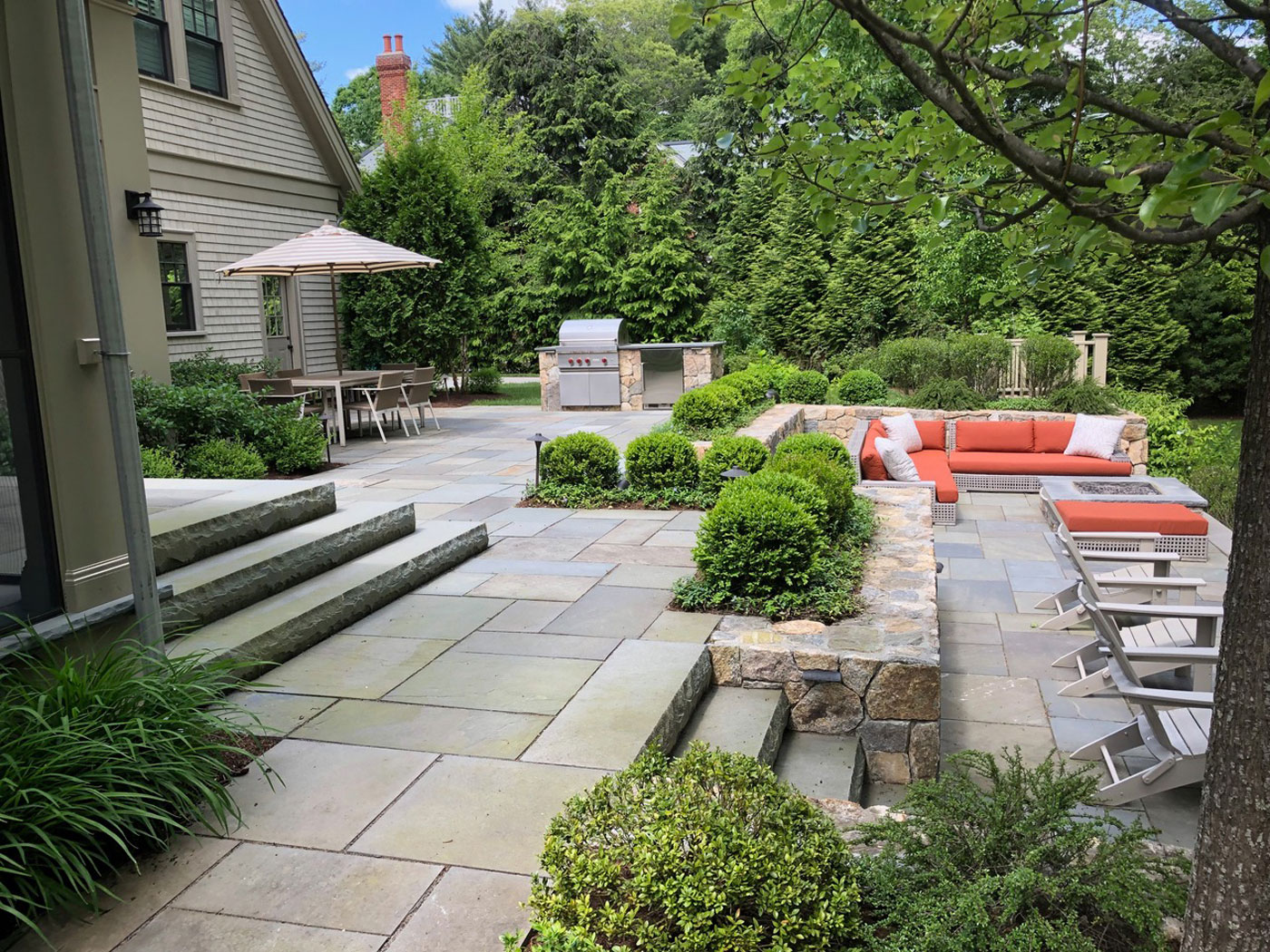 Outdoor kitchen design by high-end landscape designer and contractor a Blade of Grass