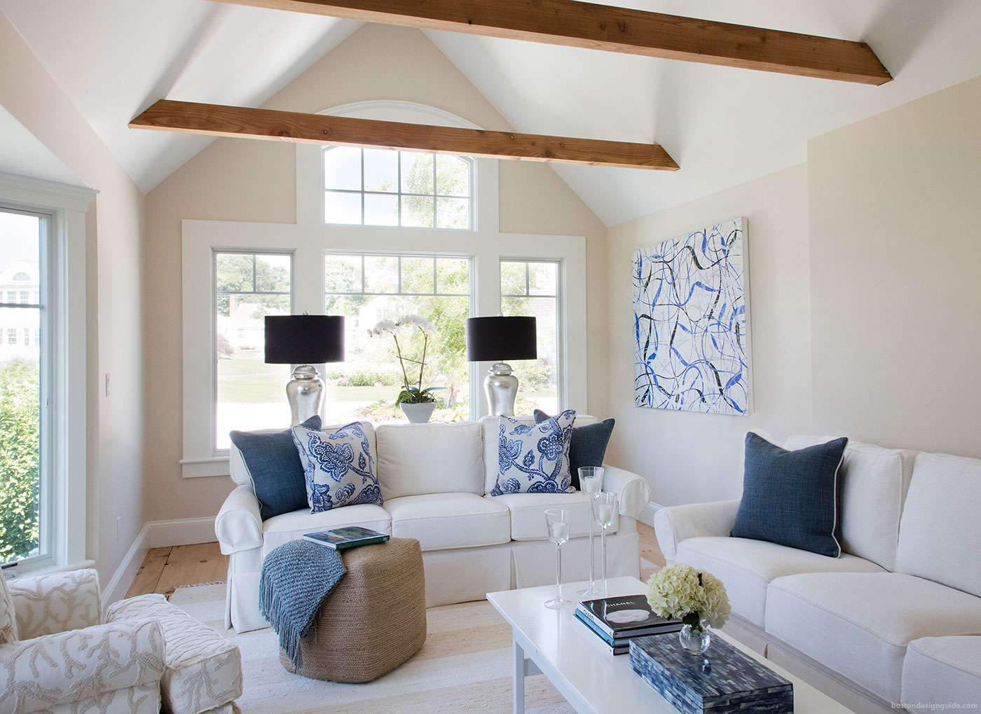 high-end white sitting room with blue accents