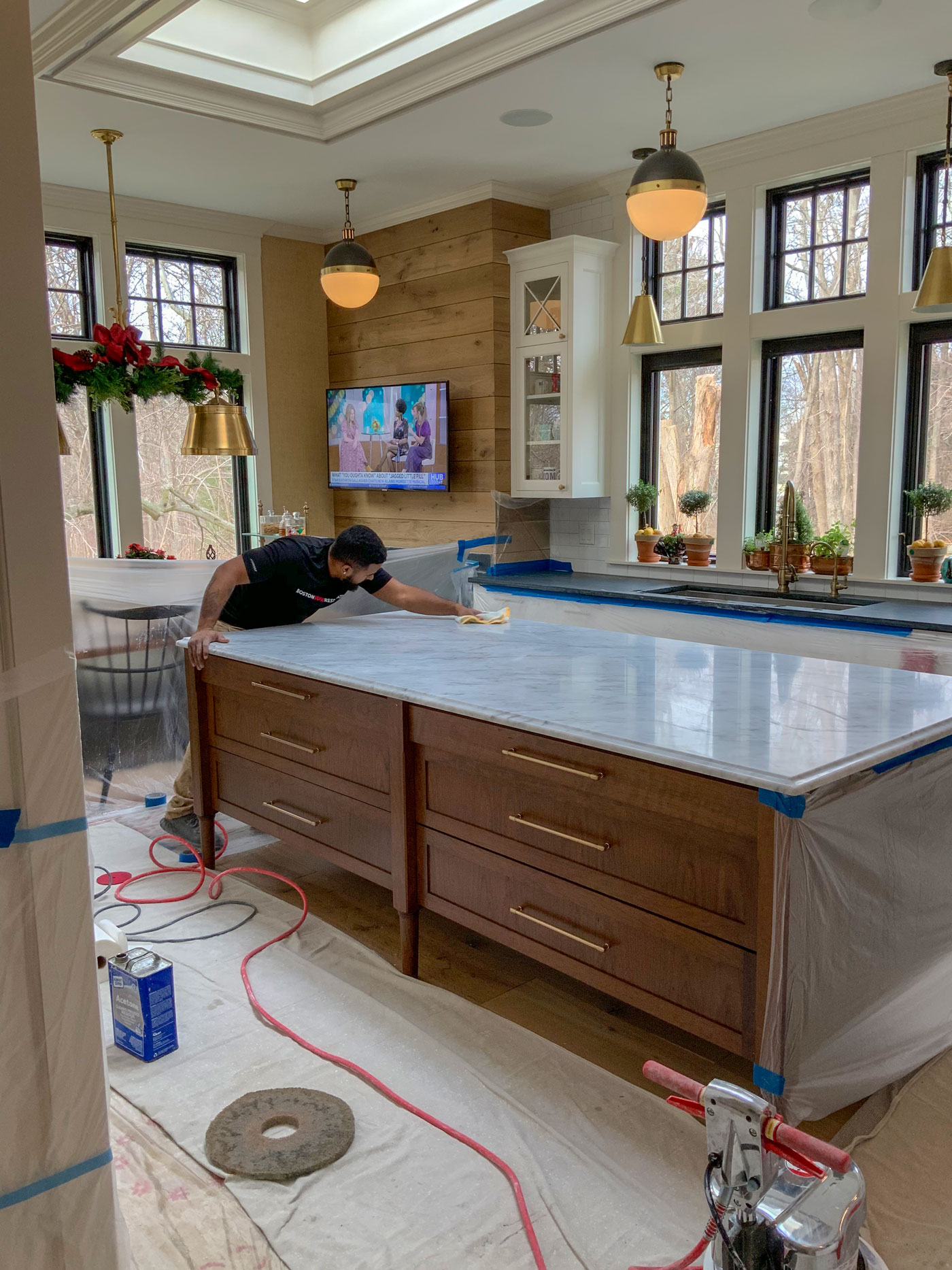 Boston Stone Restoration refines and polishes a marble kitchen island