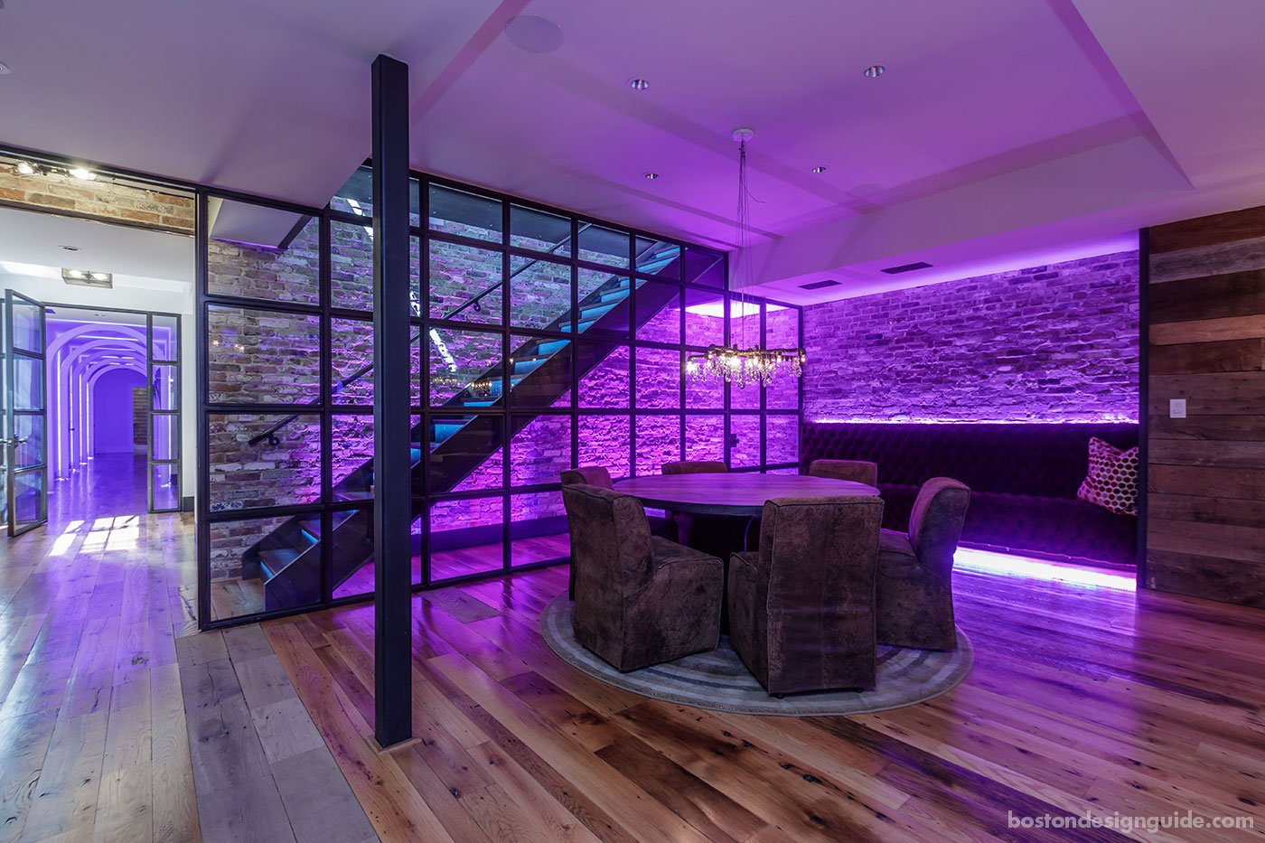 Sitting area in a party barn with violet light, designed by BPC Architecture