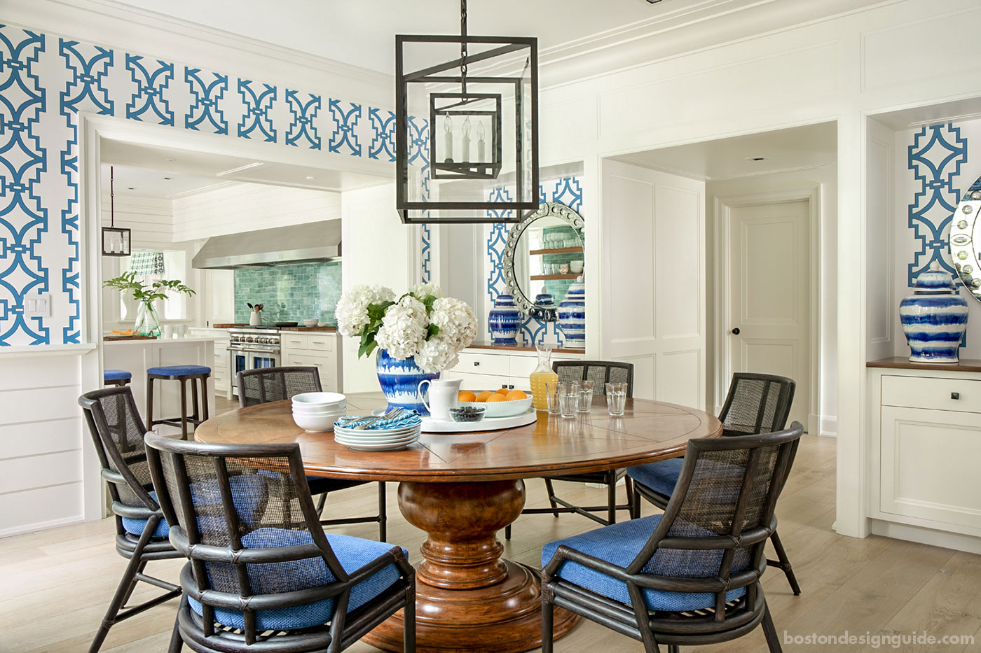 Casual Cape Cod blue and white dining room with bold patterns