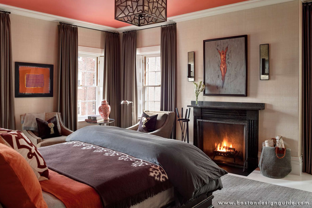 Fireside master bedroom with warm colors