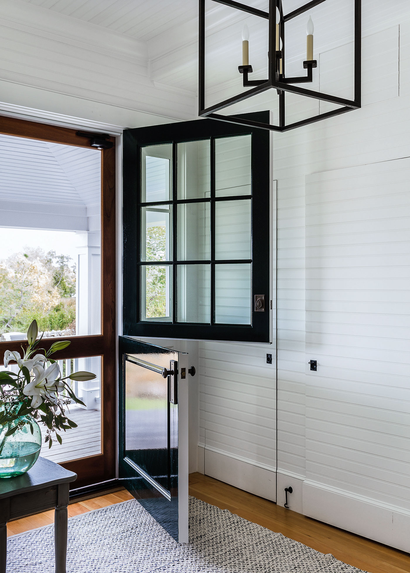 A Dutch door front entrance to a Cape Cod renovation