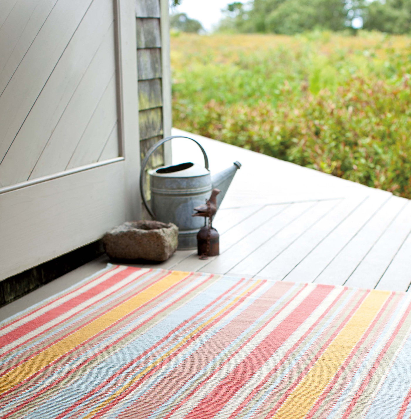 Decorating tip for your deck: indoor-outdoor rug