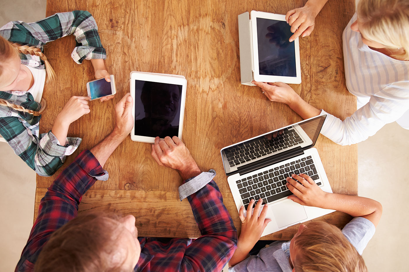 A family using electronic devices