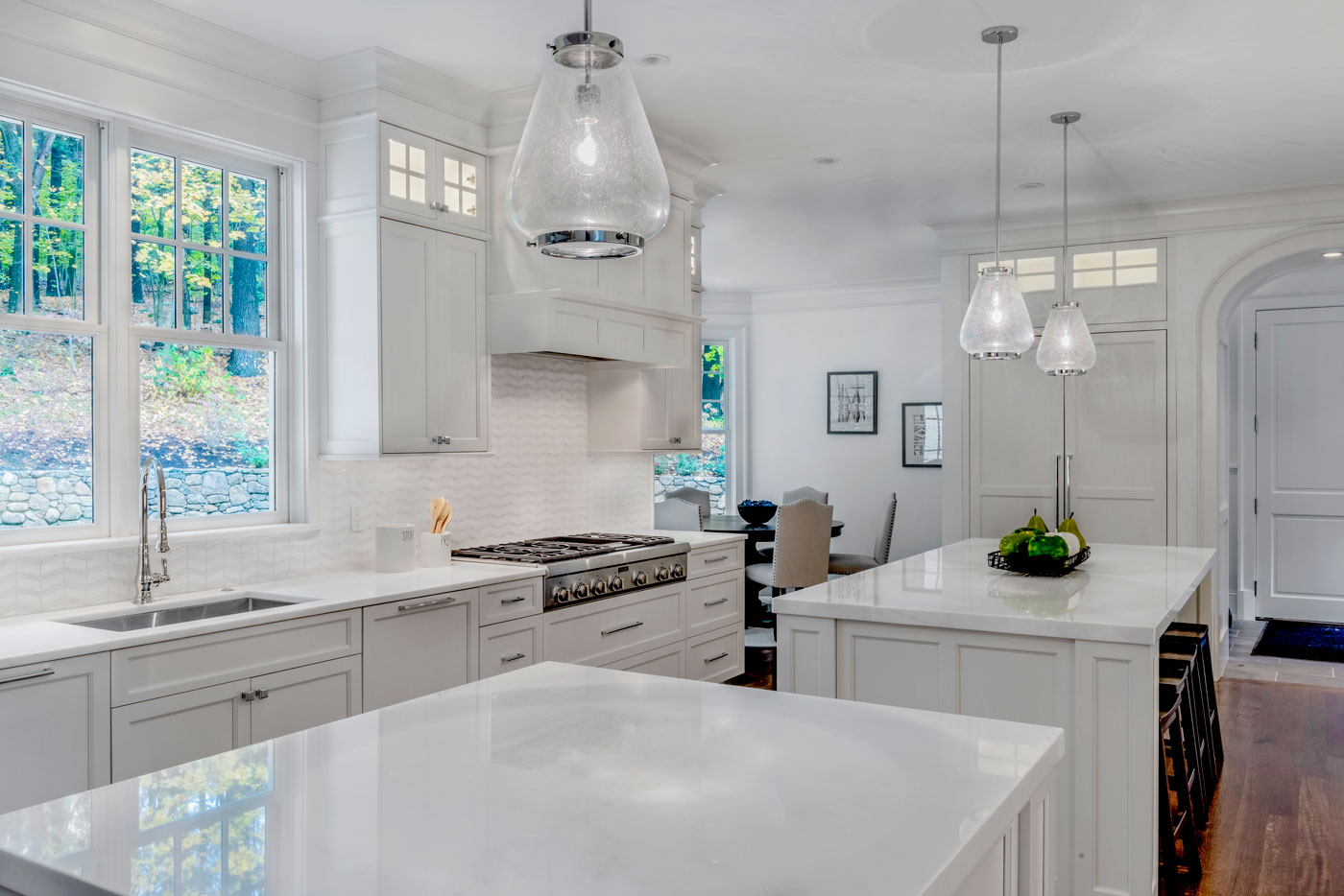 White kitchen in high-end turnkey Weston home by top Boston builder