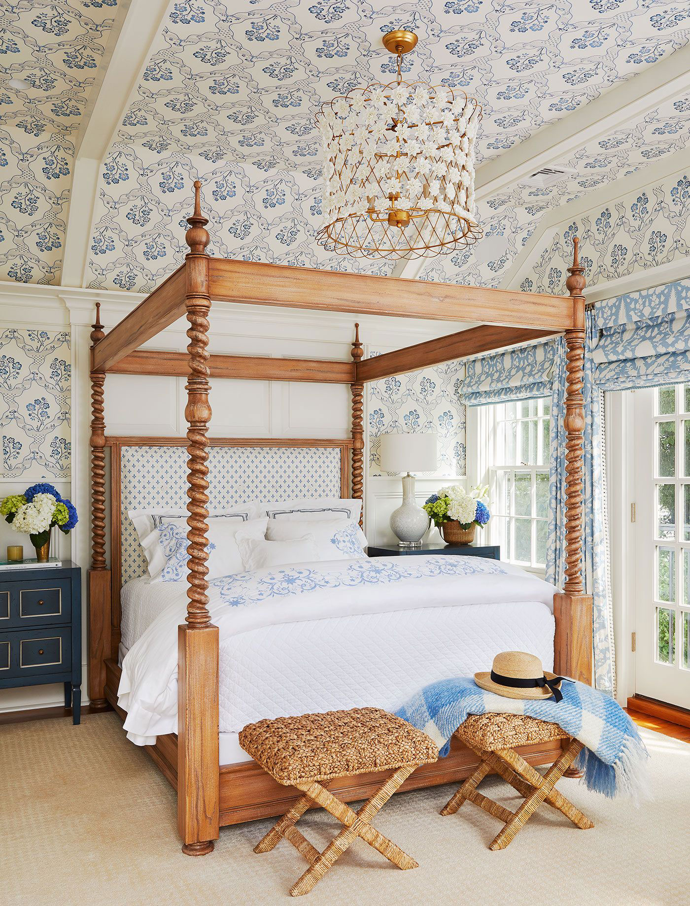 Bedroom with ceiling wallpaper and flower chandelier