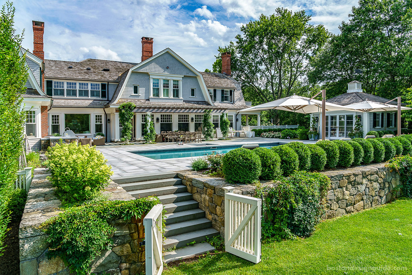 Custom pool, pool garden and pool house constructed by Onyx Corporation