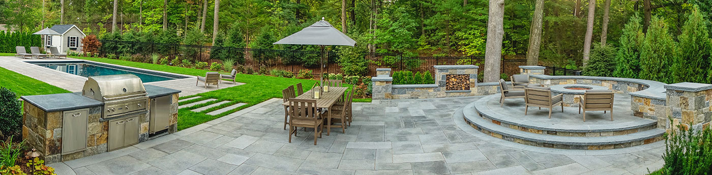 Outdoor kitchen and fire feature terrace by The MacDowell Company