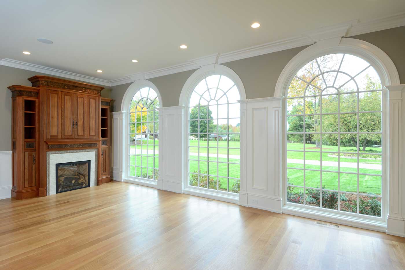 living room with floor to ceiling windows and fireplace