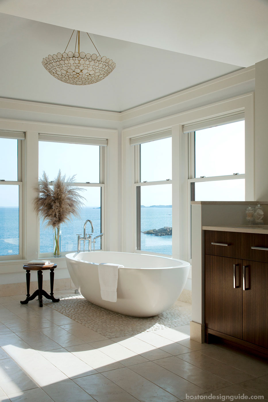 Soaking tub with oceanside views in a master bath designed by LDa Architecture & Interiors