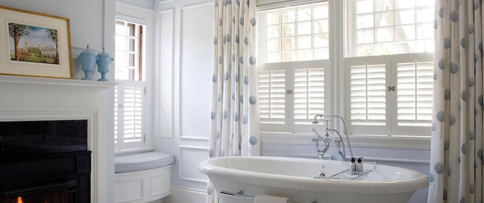 Back Bay Shutter master bath with fireplace. Meyer and Meyer Architects