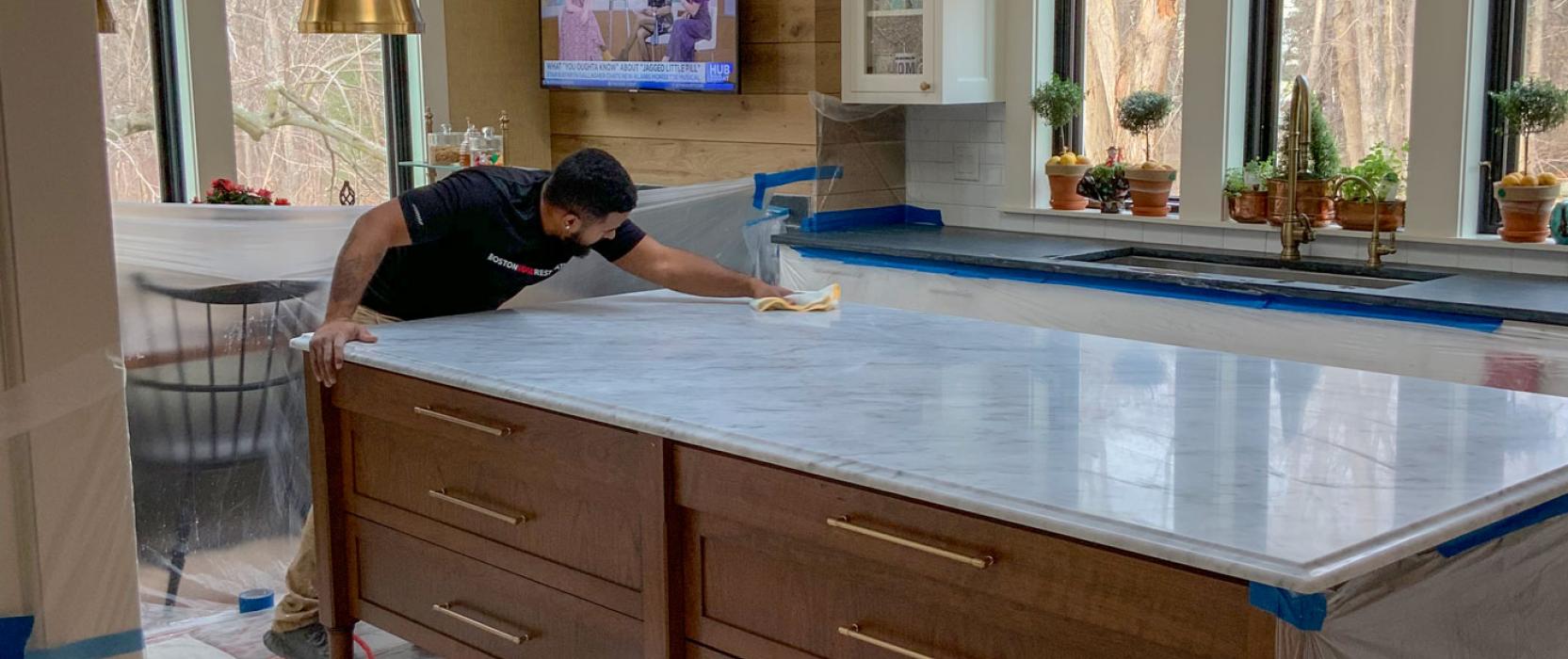 Boston Stone Restoration refines and polishes a marble kitchen island