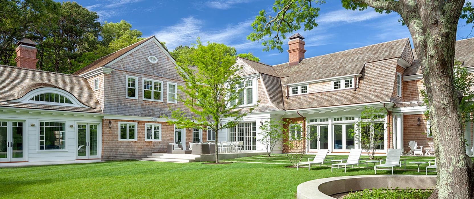 Gambrel Shingle Style Cape home designed by Catalano Architects and constructed by Travis Cundiff Associates, Inc.