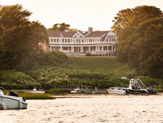 View of cape cod house from the water