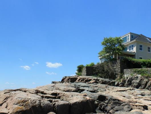 Ultra modern makeover for a traditional oceanfront home in Marblehead by Groom Construction Co.