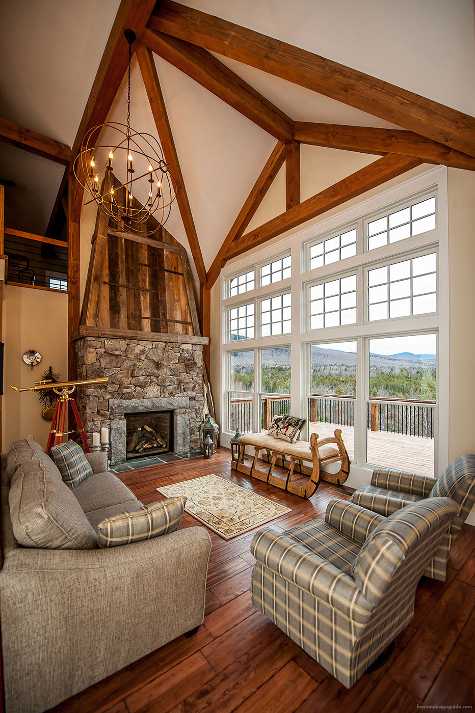 Fireplace in a mountain home by Yankee Barn Homes