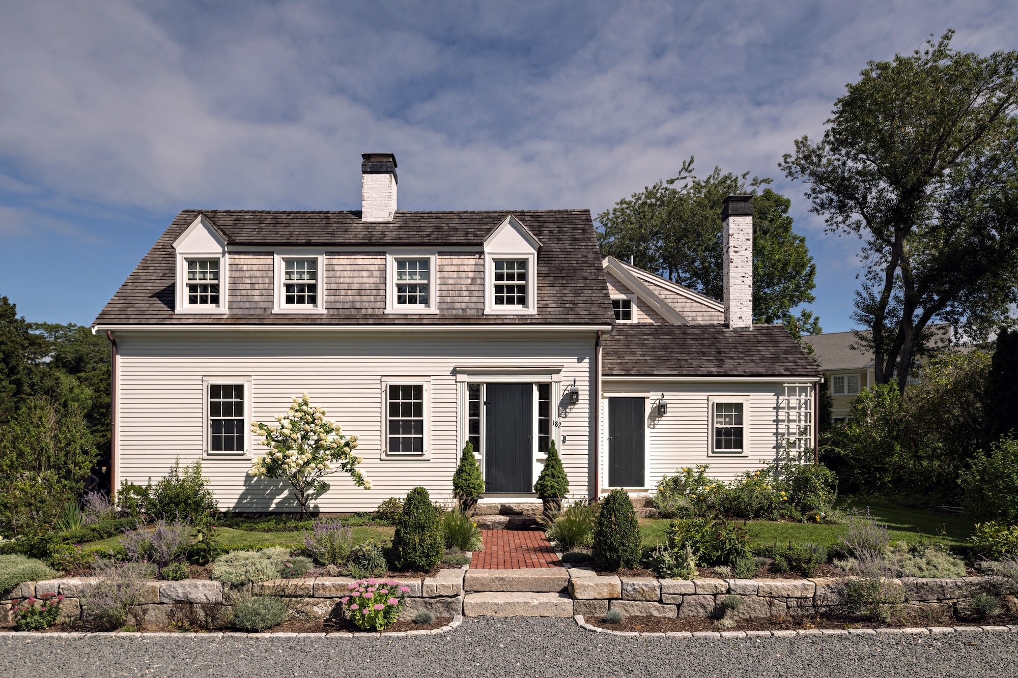 Historical home moved from its original location on the lot to a different location. Was renovated and addition added on. A few years later we added a beautiful pool and pool house. Photography: Dan Cutrona