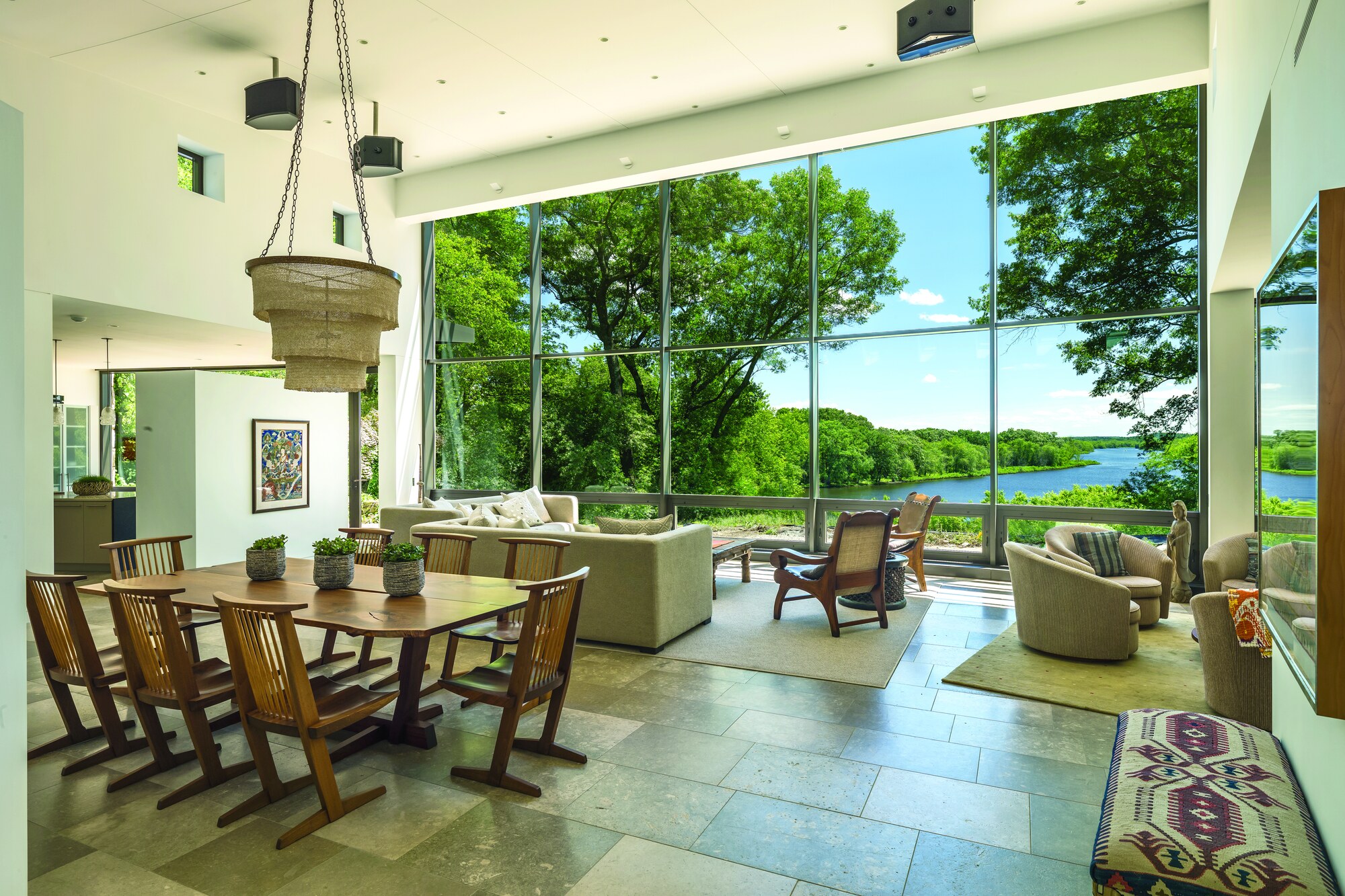 Radial Riverfront, Carlisle. The curved glass wall follows the Concord River. “The interior reveals itself slowly. With rectangular homes, it’s straight on. With the curves there’s a little bit of a mystery.” — Anthony Pisani, Pisani + Associates Architects.