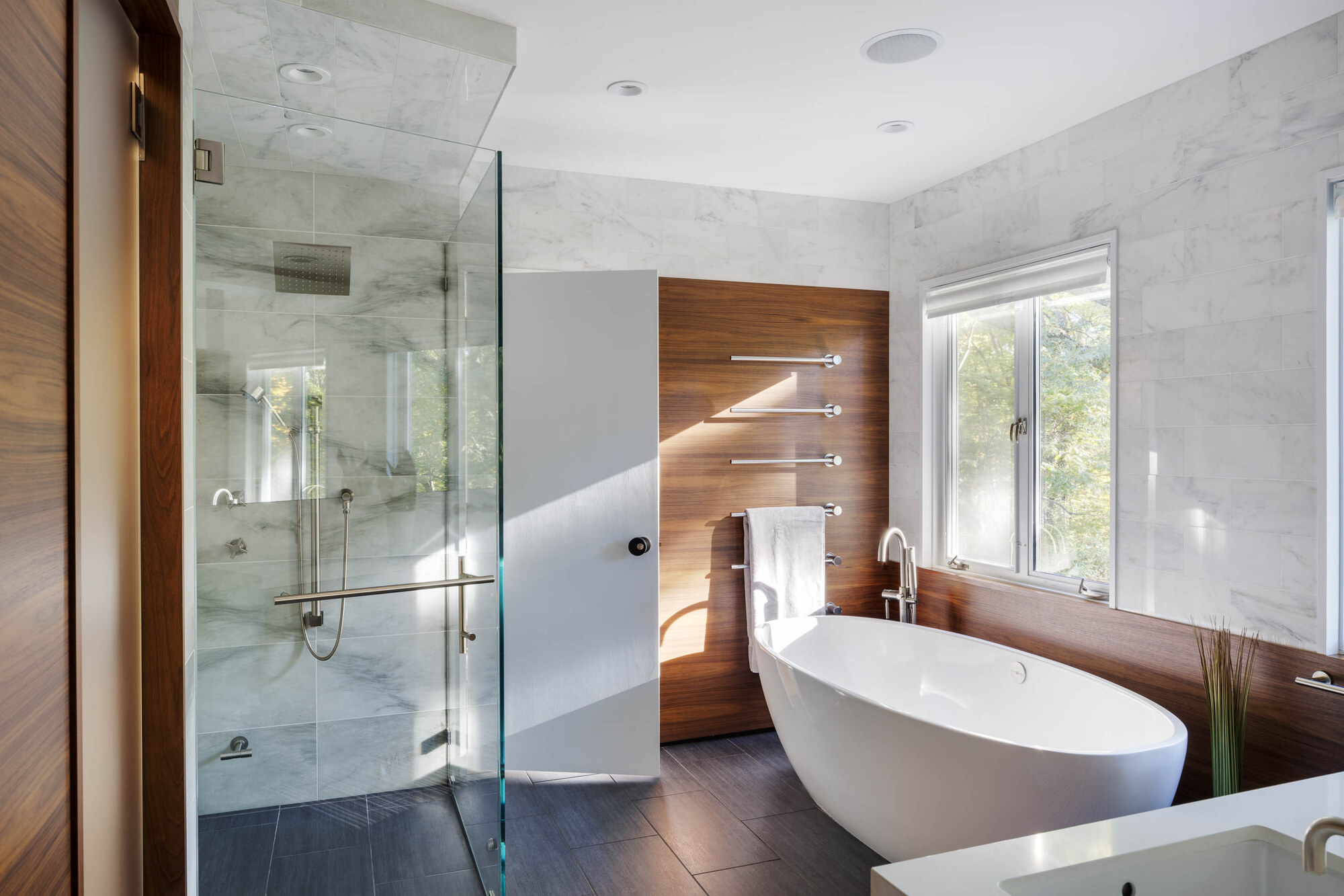 Webster Woods, Newton. Contemporary renovation with marble surrounds and walnut millwork. Architect: Lawton Design Studio. Photography: Greg Premru.
